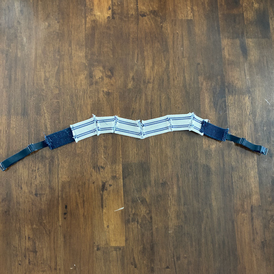 Close-up of the Overband® panel running across the top of a MAAREE sports bra.